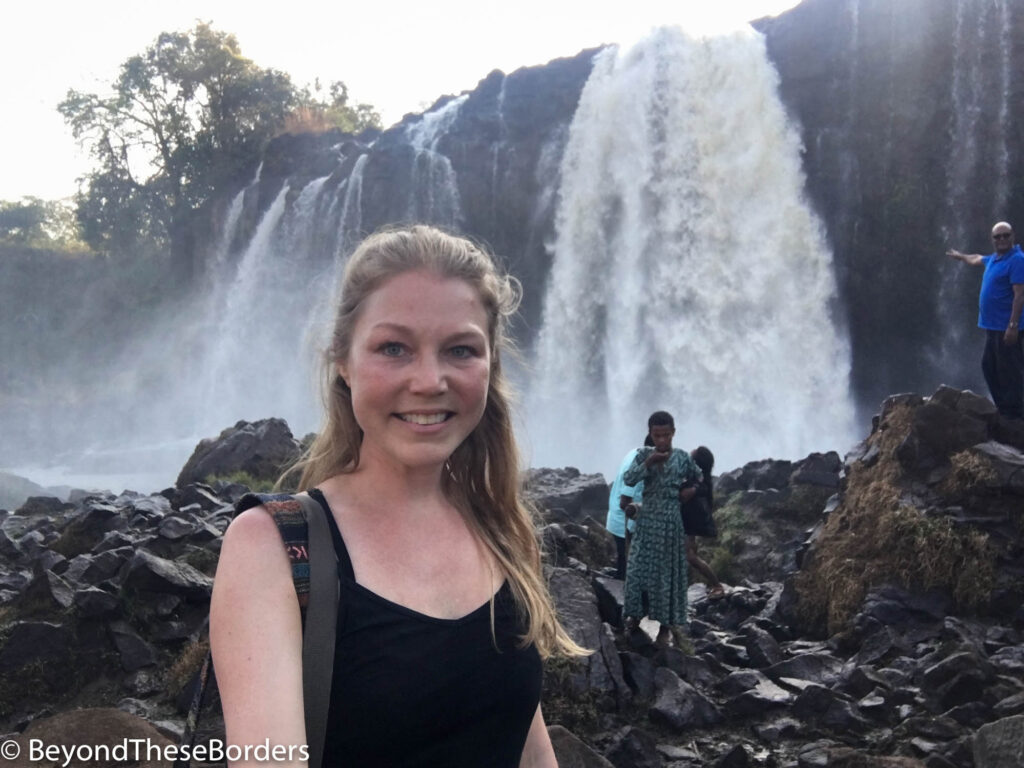 Standing in front of the Blue Nile Waterfall in Ethiopia.