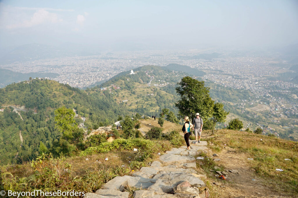 Hiking up stone steps to the Statue of Lord Shiva.  Great views of the hills and city below.