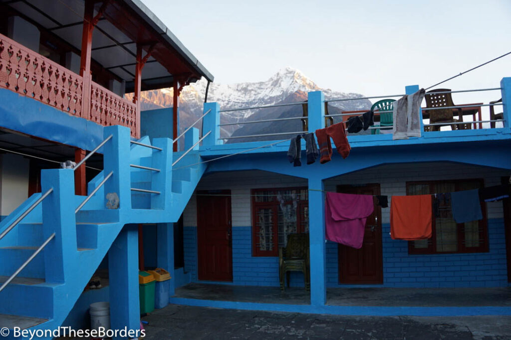 Our lodge.  Blue walls and stairs with socks and towels hung along the drying line across the frame.