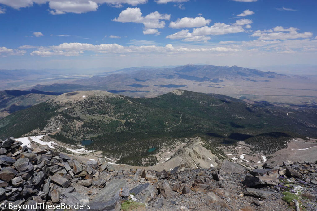 View over the pine forest below and the desert beyond.